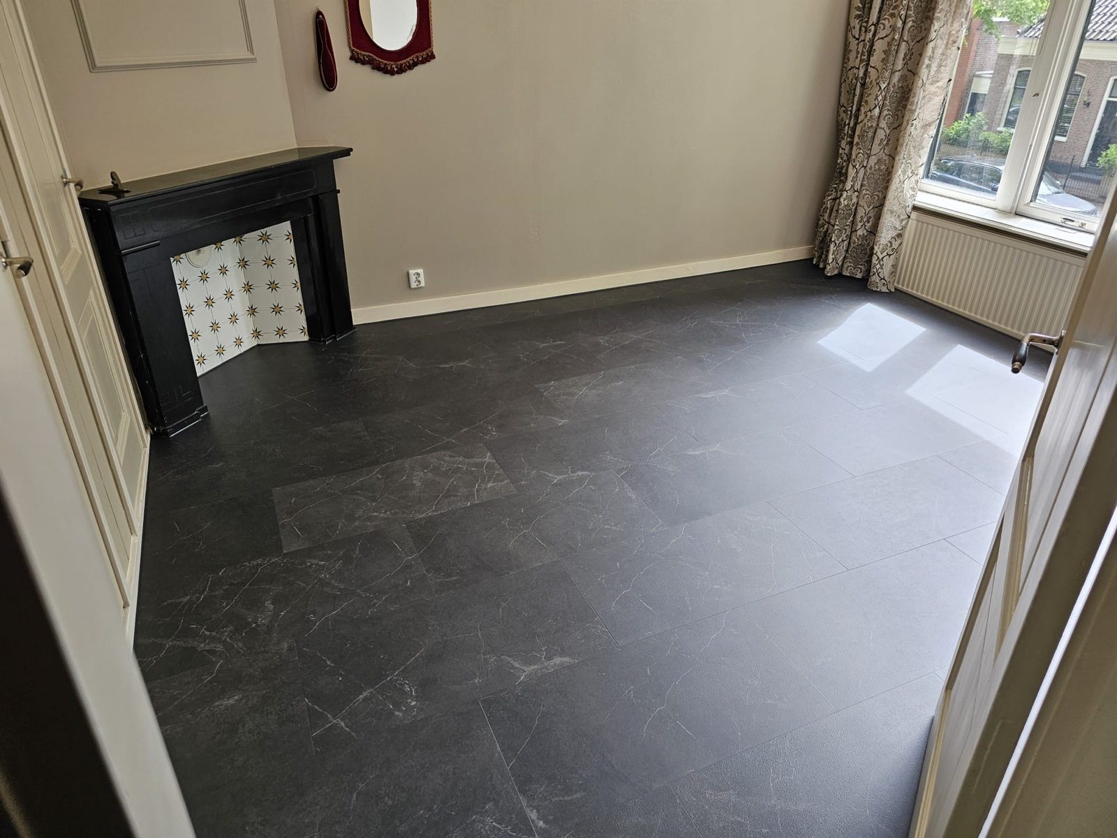 Bedroom after, with a new dark floor